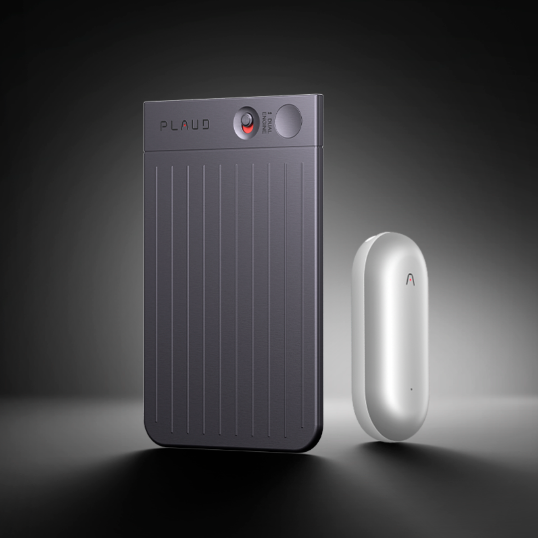 Black Plaud Note Pro with ribbed texture standing next to a silver Plaud NotePin wearable.