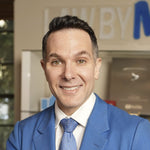 A smiling professional man in a blue suit and tie, representing a legal expert using Plaud AI note takers.