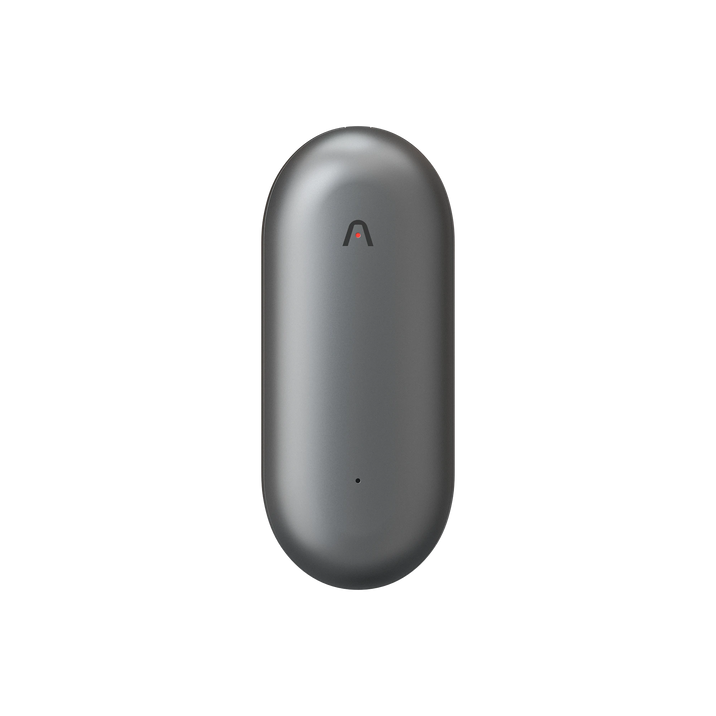 Space gray Plaud NotePin, a capsule-shaped AI voice recorder with a red indicator light.